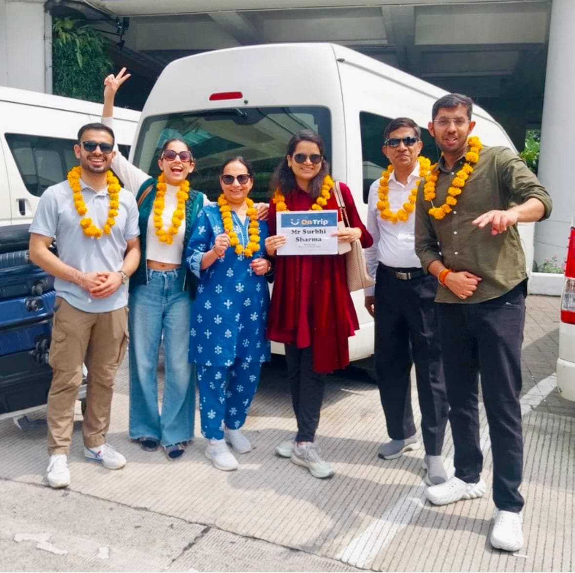 A family welcomed with garlands on arrival in Bali