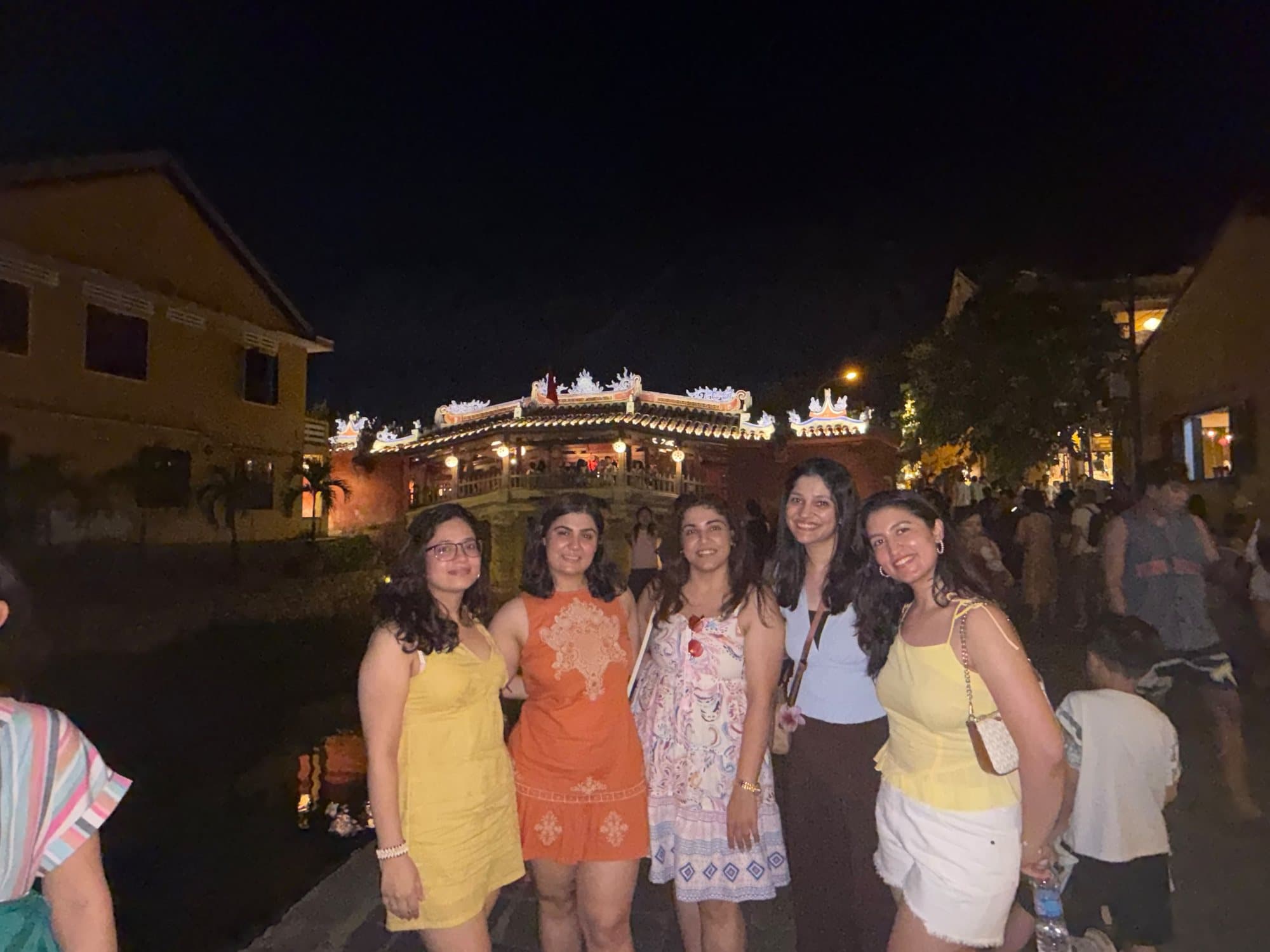 Friends by the Japanese Covered Bridge at night, Hoi An