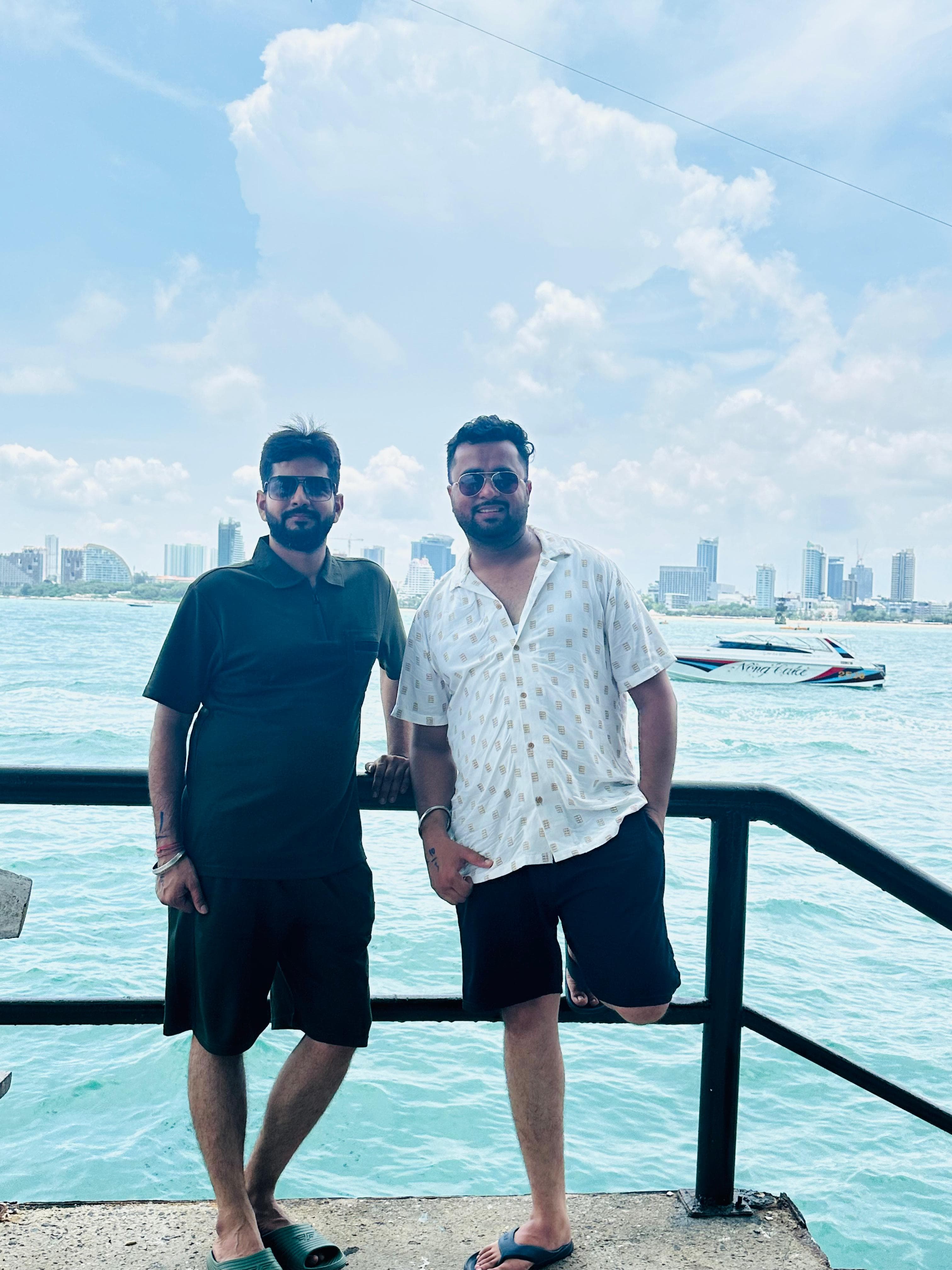Two friends on a pier in Pattaya